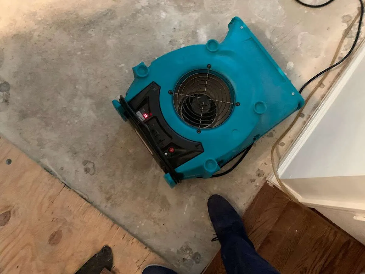 Air mover drying subfloor during Commercial Water Damage Restoration in Tucson Mountains